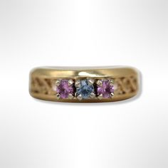 ⚓14K Gold Pink Sapphire and Sky Blue Topaz Three Stone Ring Solid 14K gold, stamped 14K. Not filled or plated.  In excellent condition. We sell the highest quality vintage and pre-owned items! Free domestic shipping always! On its way to you in 1 business day.  30 day return policy!  ⚓The Details Size 6.25 2 round pink sapphires 1 round sky blue topaz Shank of ring is yellow gold and stone settings are white gold Top of ring is 6.1 mm wide Bottom of ring is 2.5 mm wide 3.7 grams ⚓Who We Are  We are a small, family-owned business in Plymouth, MA. Located in the heart of Main Street, Main Street Jewelry Co.'s mission is to find one-of-a-kind, unique pieces. Vintage, antiques, and rare finds are our specialty, of course other than our brand new Italian silver chains with a price that can't be Gold Top, Plain Bands, Sky Blue Topaz, Three Stone Rings, Three Stone, Stone Settings, Pink Sapphire, Stone Rings, Blue Topaz