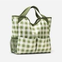 a green and white checkered tote bag with two pockets on the side,