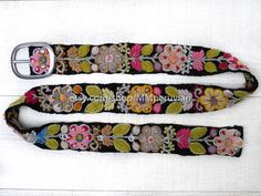 Peruvian embroidered belt floral natural organic dyes BLACKThese belts are densely embroidered using dozens of colors naturals and each one is unique. Elegant floral design and a pleasure to wear, it will bring joy to you through its visual beauty as you will want to wear it time and time again.Each belt 5 sets of holes spaced 2" apart so they are versatile. You can wear the same belt on your waist or hips. They also stretch slightly, like a pair of jeans, and will conform to your body after a f Multicolor Folk Fabric Belt, Folk Style Multicolor Fabric Belt, Multicolor Fabric Belt In Folk Style, Folk Style Multicolor Embroidered Belt, Folk Multicolor Embroidered Belt, Multicolor Embroidered Fabric Belt For Festival, Festival Fabric Belt With Multicolor Embroidery, Handmade Bohemian Belt With Multicolor Embroidery, Bohemian Fabric Belt For Festivals