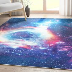 an area rug with colorful stars in the middle and a blue sky filled with clouds