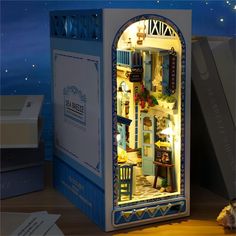 an open refrigerator with the door ajar and lights on it's sides are shown