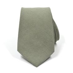 Handmade with 100% imported cotton fabric. Perfect for work, weddings or a night out on the town. This Linen Sage Green Tie will make you feel like the gentleman you aspire to be or accentuate the gentleman you already are. You’ll look good, feel good and do good things in this tie. Makes the perfect gift for a fellow gentleman or for that man in your life by making them look good and feel good. We guarantee your satisfaction with our free refund policy.* Goes Good With: Black, Grey, Tan, GreenM Fitted Cotton Tie, Dapper Cotton Ties For Formal Occasions, Dapper Cotton Tie For Formal Occasions, Formal Dapper Cotton Ties, Dapper Cotton Ties For Business, Formal Cotton Tie, Spring Business Cotton Suit And Tie Accessories, Elegant Cotton Ties For Spring, Cotton Ties For Workwear In Spring