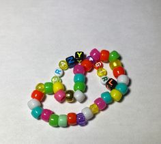 crazy girl scene kandi rainbow Braclet Multicolor Rave Friendship Bracelets As Gift, Multicolor Rave Style Friendship Bracelets As Gift, Multicolor Rave Style Friendship Bracelet For Gift, Rave Style Multicolor Friendship Bracelets, Rave Style Multicolor Friendship Bracelet Gift, Playful Multicolor Letter Beads Friendship Bracelets, Personalized Multicolor Beaded Bracelets For Rave, Personalized Multicolor Bracelets For Rave, Personalized Multicolor Rave Bracelets