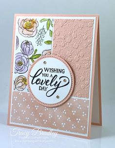 a close up of a greeting card with flowers on the front and bottom, which reads wishing you a lovely day