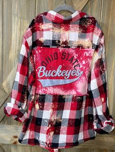 Youth artfully distressed, upcycled and sustainable flannel shirt paired with upcycled tee with graphic.  Kids love representing their teams and they will love the cozy flannel ..  All one of kind and unless noted, flannel is medium weight.  Show your pride with a unique one of a kind spirit wear. Casual Flannel Patchwork Top, Casual Flannel Top With Patchwork, Vintage Flannel Top With Graphic Print, Fall Flannel Top With Graphic Print, Upcycled Cotton Tops For Fall, Casual Distressed Plaid Tops, Casual Oversized Upcycled Tops, Spirit Wear, Cozy Flannel