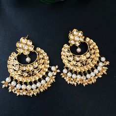 "Golden Pacchi Kundan Chandbali / Jadau Chandbali / Pakistani Chandbali / Indian Bridal Chandbali / Indian Kundan Jewelry /AryaFashions Golden Traditional Indian Pacchi Kundan Chandbalis Handcrafted To Perfection Light Weight earrings Perfect For Indian Weddings And Celebrations A Beautiful & Memorable Gift for Weddings and Special Occasions 22k gold plated jewelry Length: Approx. 3\" Comes with Push back closure" White Chandbalis For Navratri, White Chandbalis With Cutdana For Eid, Festive White Chandbalis With Cutdana, Bollywood White Tilla Chandbalis, Bollywood Style White Tilla Chandbalis, Festive White Cutdana Chandbalis, White Tilla Chandbalis For Navratri, White Chandbalis With Latkans For Festive Occasions, White Chandbalis For Celebration