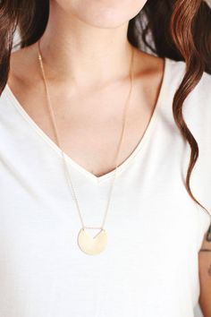 Long Minimalist Geometric Circle Necklace - Brass | 14k Gold Filled | Sterling Silver Featuring a unique geometric brass circle charm in the metal of your choice, hung on a fine metal chain. Our metal charms start as original hand or digital illustrations, that are laser cut out of metal and finished by hand. Length: 18" chain Designed & handcrafted in Richmond, VA USA MATERIAL OPTIONS: *brass pendant with 14k gold filled chain *nickel silver pendant with sterling silver chain (out of stock) *st Silver Long Necklace, Long Silver Necklace, Metal Charms, Geometric Circle, Brass Necklace, Richmond Va, Digital Illustrations, Lovely Necklace, Circle Necklace