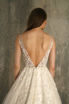 the back of a woman's wedding dress