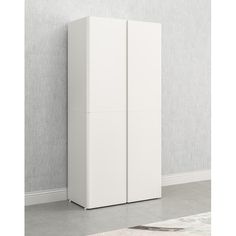 a tall white cabinet next to a wall with a rug on the floor in front of it