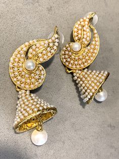 Traditional Bollywood Statement Earrings, Glamorous Indian Pearl Wedding Bell Dangles These beautiful Hollywood Regency /Bollywood Style are both Ornate and at 7mm long - make an elegant statement too! They are perfect for the holiday season- romantic and festive - and would Look lovely ringing in the New Year on New Years Eve! And Pearl is super trending, too!! If you are getting married they compliment a number of styles from Boho Glam to tribal & yoga inspired themes to more traditional v Elegant Pearl Earrings With Latkans For Reception, Pearl Drop Jhumkas For Reception And Festivals, Traditional White Pearl Earrings For Reception, Elegant White Chandbalis With Latkans, Glamorous Wedding Earrings For Festive Occasions, Glamorous Wedding Earrings For Festive Season, White Danglers With Intricate Design For Reception, Glamorous Festive Wedding Earrings, White Bollywood Earrings For Reception