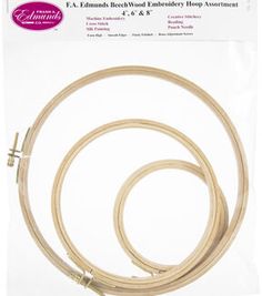 an image of a pair of wooden embroidery hoops in packaged package on white background