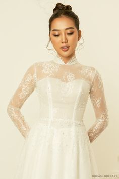 Our sweet and stylish Calixta white bridal ao dai is the perfect ensemble for modern brides who love a whimsy, girly aesthetic. Calixta features a flare A-line bottom, sheer, couture French lace detailing, silk pants, and a classic high collar. This gorgeous, romantic ao dai is the ideal fusion of traditional and modern elements. Feel unique, classy, and elegant in Calixta! Detail: White Vietnamese Ao Dai Collar: 1.2''/3cm Long sleeves Bra cups added Zipper closure Flare A-line bottom Floor len Sheer Couture, Bridal Ao Dai, Vietnamese Ao Dai, Girly Aesthetic, Dream Dresses, Modern Elements, Bridal Robes, Silk Pants, White Bridal