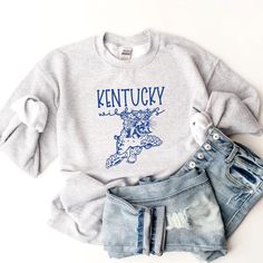 Vintage Wildcats Kentucky shirt!  Unisex Sizing!  The tee listed has the design on an ash gray shirt (1st photo), but we can also do on a different color!  For an option not listed, send us a message!  🔹T SHIRTS🔹 Adult S-XL Adult 2X Adult 3X 🔹LONG SLEEVE T SHIRTS & SWEATSHIRTS🔹  Adult S-XL  Adult 2X Adult 3X If you would like to request a custom order,   please send us a message! Game Day T Shirt, Kentucky Sweatshirt, Kentucky Shirts, Message T Shirts, Cats Shirt, Ash Gray, Womens Sweatshirts, Gray Shirt, Gildan Sweatshirts