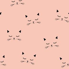 a pink background with black cat's faces and eyes