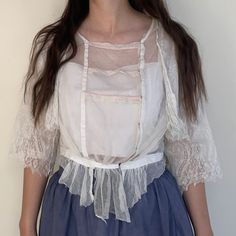 "Antique sheer Edwardian blouse. Made from netting and lace with a gathered waist. Front closure. Size Estimate: Small Measurements  Bust: 40\" / Waist: 28\" / Length: 21\" / Shoulders: 16\" Condition Two small mends on back sleeves and a few small holes in netting as shown. Great condition for age and wearable with care. Follow @willavintage on Instagram --------------------------------------------------------------------------------------- All items are vintage and most are pre-worn. Imperfect Sheer Fitted Blouse For Daywear, Fitted Sheer Blouse For Daywear, Feminine Lace Top With Lace Sleeves For Daywear, Fitted Lace Top With Lace Sleeves For Daywear, Short Sleeve Lace Top For Daywear, Sheer Blouse For Daywear, Lace Blouse With Sheer Sleeves For Wedding, Wedding Blouse With Sheer Lace Sleeves, Fitted Lace Patchwork Tops For Daywear