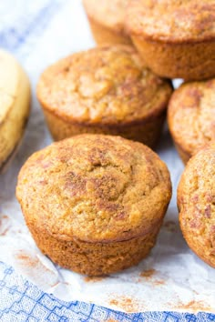 several muffins sitting on top of a table next to some banana's