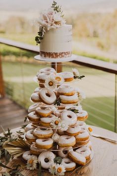 a wedding cake made out of donuts and flowers