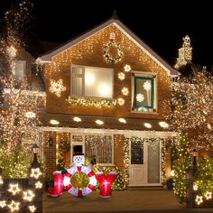 a house decorated with christmas lights and decorations