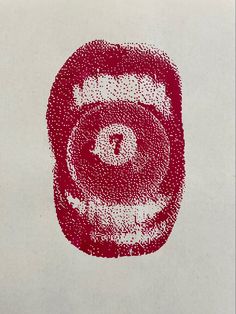 a red and white painting with dots on it's face in the shape of a circle