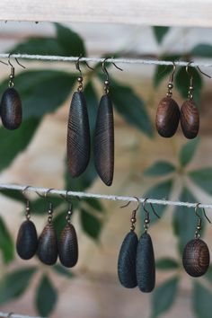 Very special bog oak earrings. Bog oak is oak wood that has been lying in water, river bottom for hundreds and thousands of years.  Earrings have different shapes, that are made with sanding method. Bog Oak Jewelry, Lying In Water, Wooden Peace Sign, Hundreds And Thousands, Water River, Wooden Flag, Wooden Bead Garland, Wooden Cake, Wooden Stars