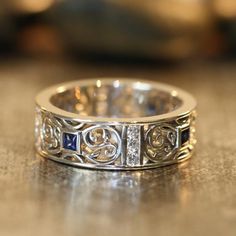 a close up of a wedding ring on a table