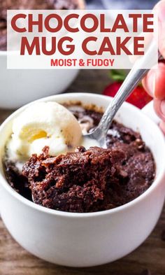 a person scooping ice cream out of a bowl filled with brownies and strawberries