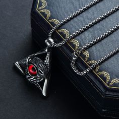 Embrace the mystery and symbolism of the Eye of Providence with this stunning necklace. The silver stainless steel chain is adorned with a vibrant red All Seeing Eye pendant, making a bold statement. Show off your unique style and embrace the power of this ancient symbol. We ship worldwide to 185 countries! Please allow 1-2 business weeks for your order to arrive. The Eye Of Providence, Eye Of Providence, Pendant Making, Seeing Eye, All Seeing Eye, All Seeing, Eye Pendant, Ancient Symbols, Stunning Necklace