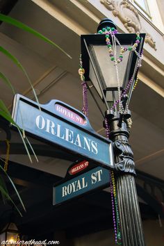 the street signs are clearly visible for everyone to see on this post in new orleans