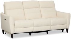 a white couch sitting on top of a wooden frame