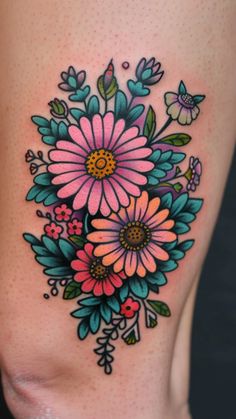 a woman's thigh with flowers on it