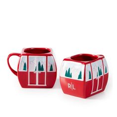 two red and white mugs with trees on them