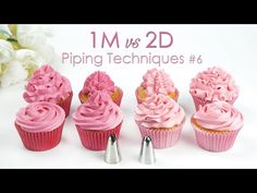 pink cupcakes with icing being used to decorate them