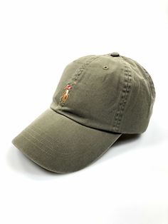 This baseball cap is an easy way to add a dose of the season's vibrant color to your off-duty look. It's garment-washed to create cool variations in tone, and the chino fabric will only get better with wear. DETAILS                                 Seamed bill. Six-panel construction. Embroidered ventilating grommets. Multicolored signature embroidered pony at the center front. Embroidered "Polo" and a slider buckle at the back. Sweatband at the interior. Interior sweatband. 23" inner circumference. 100% cotton. Spot clean. Imported. Due to the natural characteristics of this material, the coloring may rub off onto fabrics and upholstery. PAYMENT I accept PayPal payments. Please pay as soon as the auction is finished or I will cancel the winning bid. If you don't plan on paying, please hold Ralph Lauren Hats, Green Hat, Ralph Lauren Green, Green Hats, Lauren Green, Tag Sale, Colourful Outfits, Get Better, Green Color