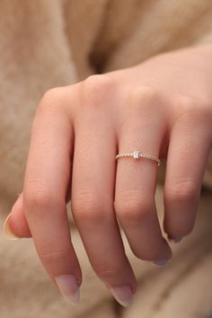 "14k & 18k Baguette Diamond Band / Half Eternity Baguette Diamond Ring / Gold Diamond Minimalist Ring Available in Gold,Rose Gold,White Gold ❥ ITEM DETAILS ---> Gold Color of Choice : Yellow Gold, Rose Gold, White Gold ---> Material : 14k ( 585 ) or 18k ( 750 ) Real Gold. It is Not Gold Filled or Gold Plated ---> Made to order ---> Band Thickness : 1.25 mm ---> Band Width : 1.20 mm ---> Clarity : H color VS/SI ---> Diamond Cut: Round & Baguette ---> Number of Ston Dainty White Gold Ring With Baguette Diamonds, Minimalist Baguette Diamond Ring, Dainty Emerald Cut Diamond Ring With Baguette Diamonds, Dainty Baguette Cut Ring With Single Diamond, Dainty Single Diamond Baguette Cut Ring, Dainty Baguette Cut Diamond Ring, Dainty White Gold Rings With Baguette Diamonds, Everyday Rose Gold Jewelry With Baguette Diamonds, Delicate 14k Gold Baguette Cut Ring