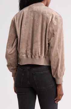 A roomy hood furthers the comfort of this bomber jacket that's cut from faux suede and adds instant charm to even your most casual ensemble. Front zip closure Fixed hood Long sleeves Front slant pocket; sleeve zip pocket Lined 90% polyester, 10% spandex faux suede Dry clean Imported Casual Spring Leather Jacket With Suede Overlays, Casual Leather Jacket With Suede Overlays For Spring, Casual Outerwear With Suede Overlays, Casual Suede Leather Jacket With Suede Overlays, Casual Suede Leather Jacket With Overlays, Casual Fall Outerwear With Suede Overlays, Casual Suede Overlay Outerwear For Fall, Casual Suede Jacket With Suede Overlays, Casual Suede Overlay Long Sleeve Outerwear