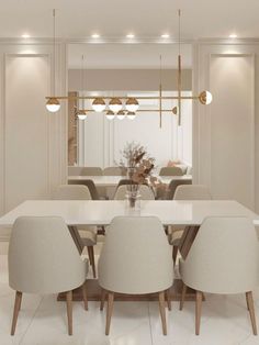 a dining room table with chairs and a vase filled with flowers