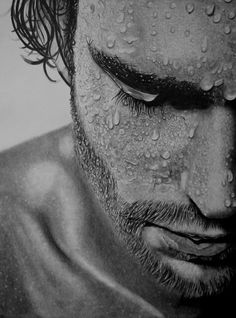 a black and white drawing of a man's face covered in water drops