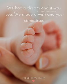 a person holding a baby's foot in their hands with the words, we had a dream and it was you we made a wish and you came true