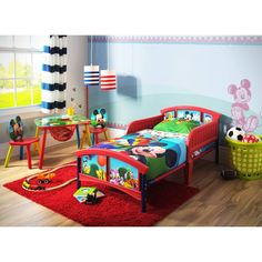 a child's bedroom with mickey mouse theme