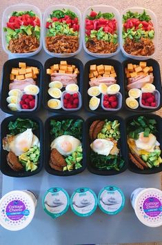 an assortment of food in plastic containers on a table