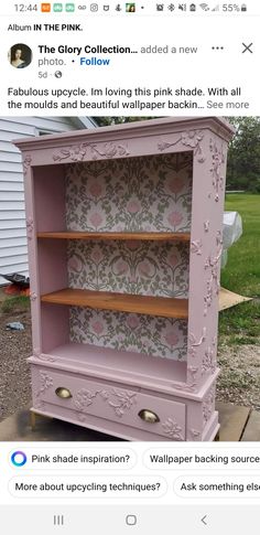 an old pink dresser has been painted with wallpaper