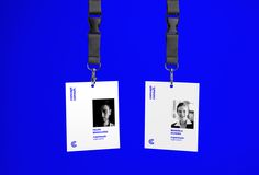 two id cards with lanyards attached to each other on a blue background,