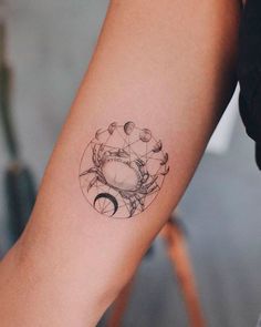 a woman's arm with a tattoo on it