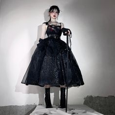 A jumper skirt, corset, and arm cover with a snake scale pattern that has a mysterious and dark atmosphere. The snake's scales overlap each other, creating a three-dimensional effect with varying shading. A bright red snake is embroidered on the chest. The skirt part of the jumper skirt has a two-layer structure made of tulle fabric. 
 
 

 

 
 
 Item 
 
 Jumper skirt + corset (*belt not included) 
 Arm cover 
 
 
 Size 
 
 Jumper skirt + corset (*belt not included) 
 
 S size 
 
 Length: 109cm Alternative Overbust Corset Dress For Party, Punk Style Ruffled Corset Dress For Cosplay, Punk Ruffled Corset Dress For Cosplay, Punk Ruffle Corset Dress For Cosplay, Snake Scale Pattern, Dark Atmosphere, Skirt Corset, Snake Scales, Red Snake