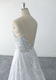 the back of a white dress on a mannequin