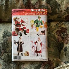 a book with pictures of santa clauss and other christmas decorations on top of it