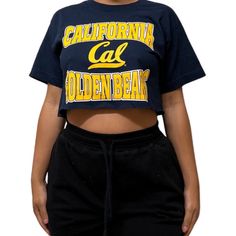 Vintage College Crop Tees Shop our vintage crop tees that vary from a range of different graphics and colors All items you see are unique and the only one available in our shop Items fit true to size All items have been cut and altered into a crop tee All items are pre-worn, recycled, well kept items that are perfect for game days, college gatherings, every day wear, and more! If you have any questions about fit or the items, please send me a message before purchase. Thank you and happy shopping Streetwear Screen Print Cropped Top, Streetwear Crop Top With Screen Print, Streetwear Cropped Crop Top With Screen Print, Slogan Crop Top T-shirt For Streetwear, Screen Print Cotton Cropped T-shirt, Graphic Tee Cropped Shirt With Logo For Streetwear, Graphic Tee Cropped Shirt For Streetwear, 90s Cropped T-shirt For Streetwear, Retro Crop Top T-shirt For Streetwear