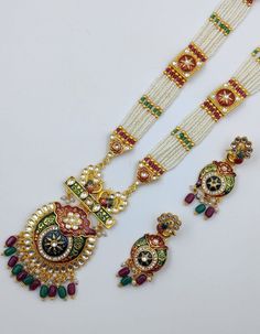 Most Gorgeous Indian Traditional Wedding Style Big Kundan Jewelry Set Reverse Meenakari Work This Long Ranihaar set is crafted with high-quality Kundan stones and stunning maroon-colored glass beads. Exude a Royal look with this Pleasing Monalisa beaded set on any occasion. Multicolor Meenakari Temple Jewelry Sets, Elegant Multicolor Bridal Sets With Stone Work, Elegant Multicolor Bridal Sets For Festive Occasions, Multicolor Kundan Necklace With Zari Work, Traditional Multicolor Kundan Necklace With Zari Work, White Kundan Sets For Celebrations, Wedding Sets With Stone Work In Multicolor, Traditional Stone Work Sets For Celebration, White Bridal Sets For Eid Festive Occasion