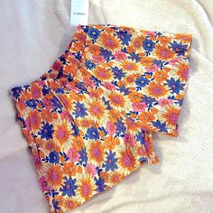 Forever 21 Size Small Shorts With Elastic Waistband And Pockets At The Side. Orange Shorts With Beautiful Multicolored Floral Design With Pink, Purple, Blue And Orange Flowers. New With Tags And From A Smoke Free, Pet Free Home. No Rips, Tears, Stains Or Holes. Perfect For Summer. Material Is 86% Rayon, 13% Nylon/Polyamide, 1% Spandex Tags: #Boho #Bohemian #Bohochic #Shorts #Summer #Floral #Flowers #Vintage #Preppy #Sunset Orange Stretch Shorts With Elastic Waistband, Multicolor Stretch Pajama Shorts For Spring, Orange Shorts For Loungewear In Spring, Orange Shorts For Spring Loungewear, Multicolor Stretch Pajama Shorts For Summer, Forever 21 Summer Vacation Bottoms, Orange Shorts With Elastic Waistband For Summer, Trendy Orange Shorts For Loungewear, Forever 21 Bottoms For Beach Vacation