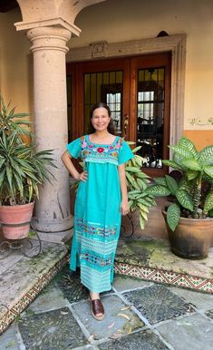 Long Mexican dress embroidered with bright colors in silk thread, with lace details and ribbons. Dress up for any occasion and can be worn with a belt. The belt is not included. This dress comes in 2 sizes and fits S/M L/XL The embroidery is unique to each dress so colors may vary. We ship anywhere in the world, from Tepic, Nayarit, MX. Made by artisans from Oaxaca, Mx We recommend hand washing with cold water, gentle to the shade, to better preserve the original color. Maxi Length Dress With Multicolor Embroidery And Embroidered Border, Maxi Dress With Multicolor Embroidery And Embroidered Border, Floral Embroidery Maxi Dress For Fiesta, Bohemian Green Maxi Dress With Floral Embroidery, Maxi Length Dress With Floral Embroidery For Fiesta, Maxi Length Dress With Multicolor Embroidered Border, Fiesta Maxi Embroidered Dress With Floral Details, Traditional Maxi Dress With Floral Embroidery For Fiesta, Fiesta Maxi Dress With Floral Embroidery